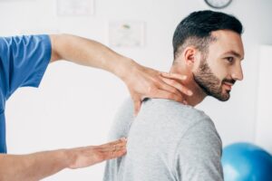 man getting treatment with a chiropractor